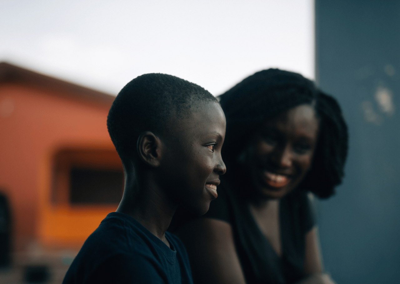 A african boy and woman smiling