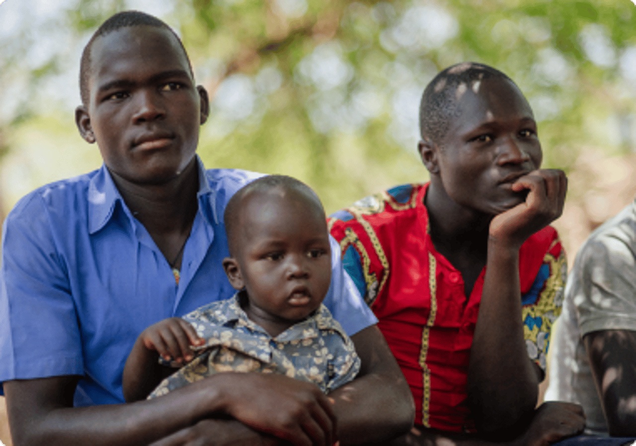 Father holding toddler son