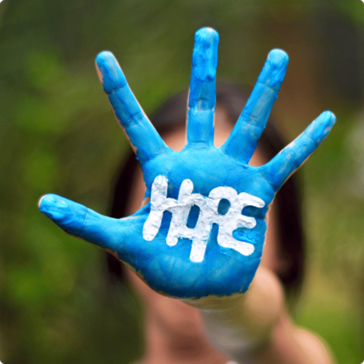 Home written on blue painted hand