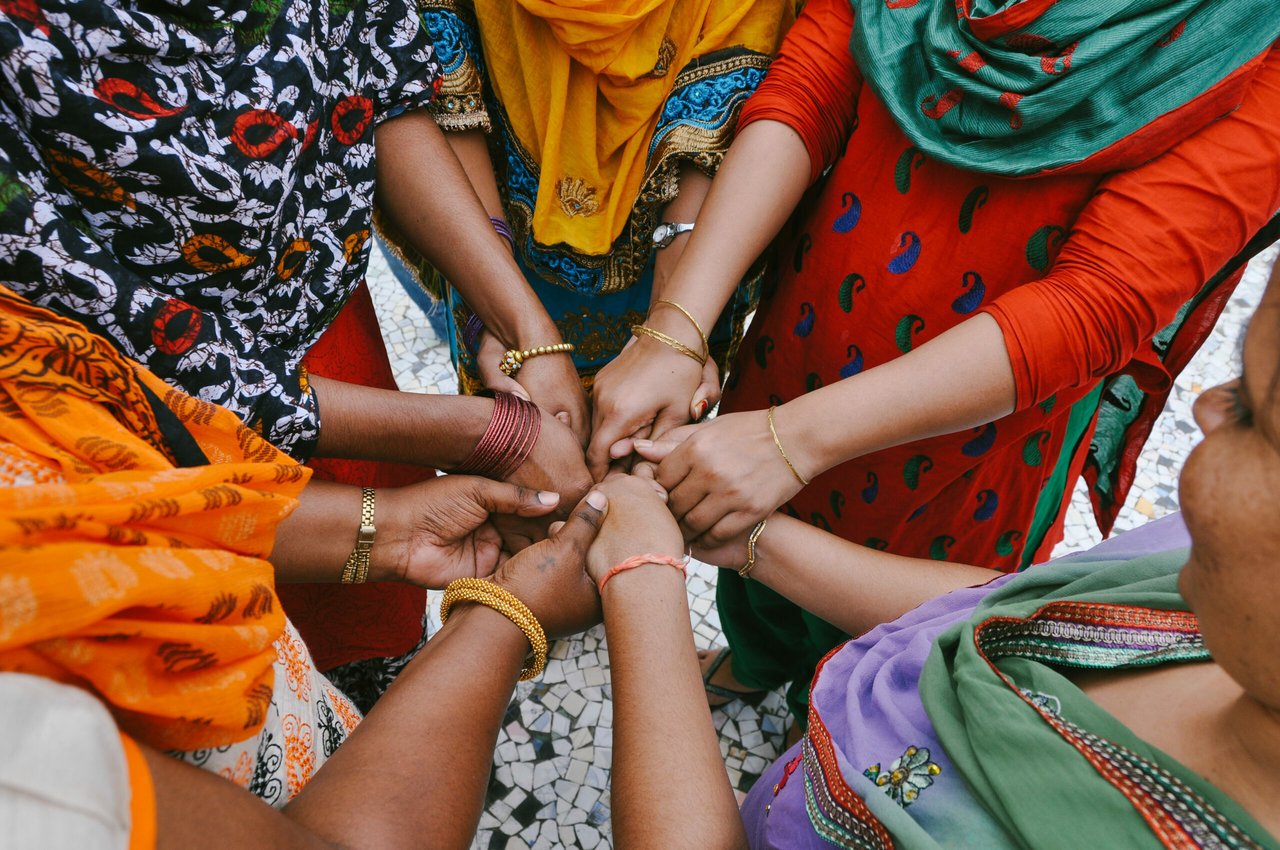 Women holding hands